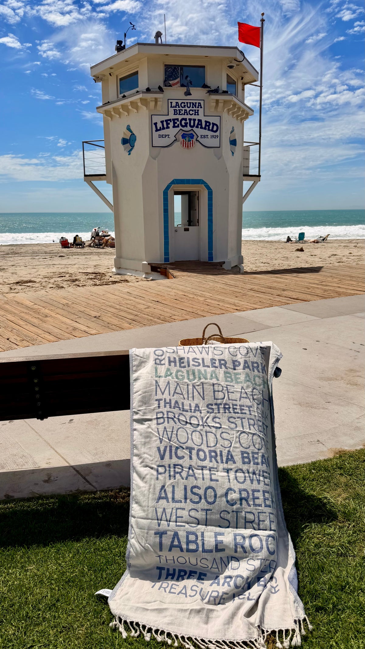 Laguna Beaches Turkish cotton beach towel displayed near the Laguna Beach lifeguard tower