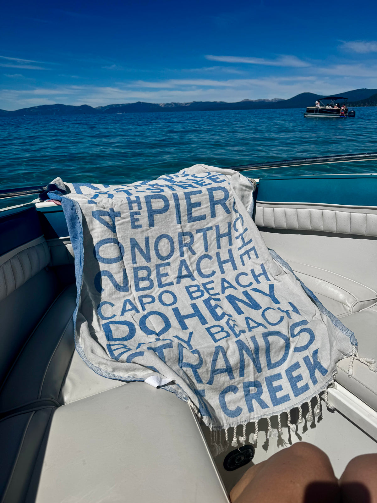 South OC Beaches Turkish cotton beach towel on a boat day in Lake Tahoe