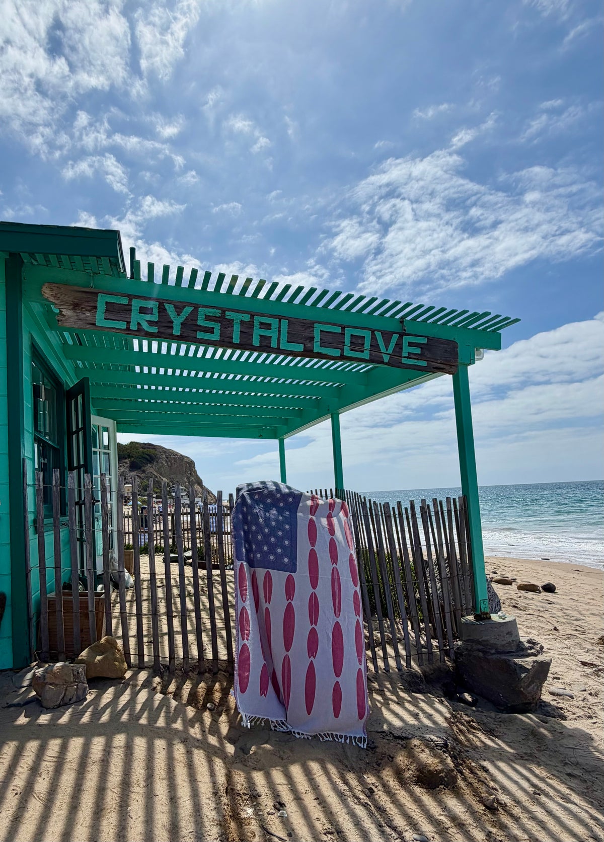 Americana Surfboard Turkish cotton beach towel displayed at Crystal Cove by the beach